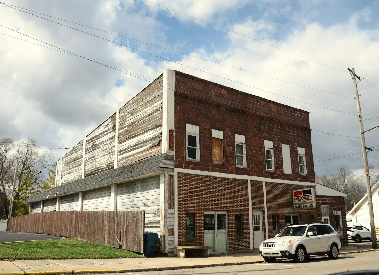 A two-story brick commercial building on a small-town corner